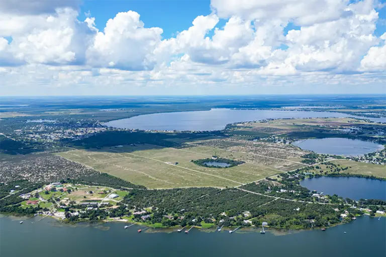 Aerial View of Land for Sale in Lake Placid, Florida called Lost Lake Groves, with Lake Placid in the background